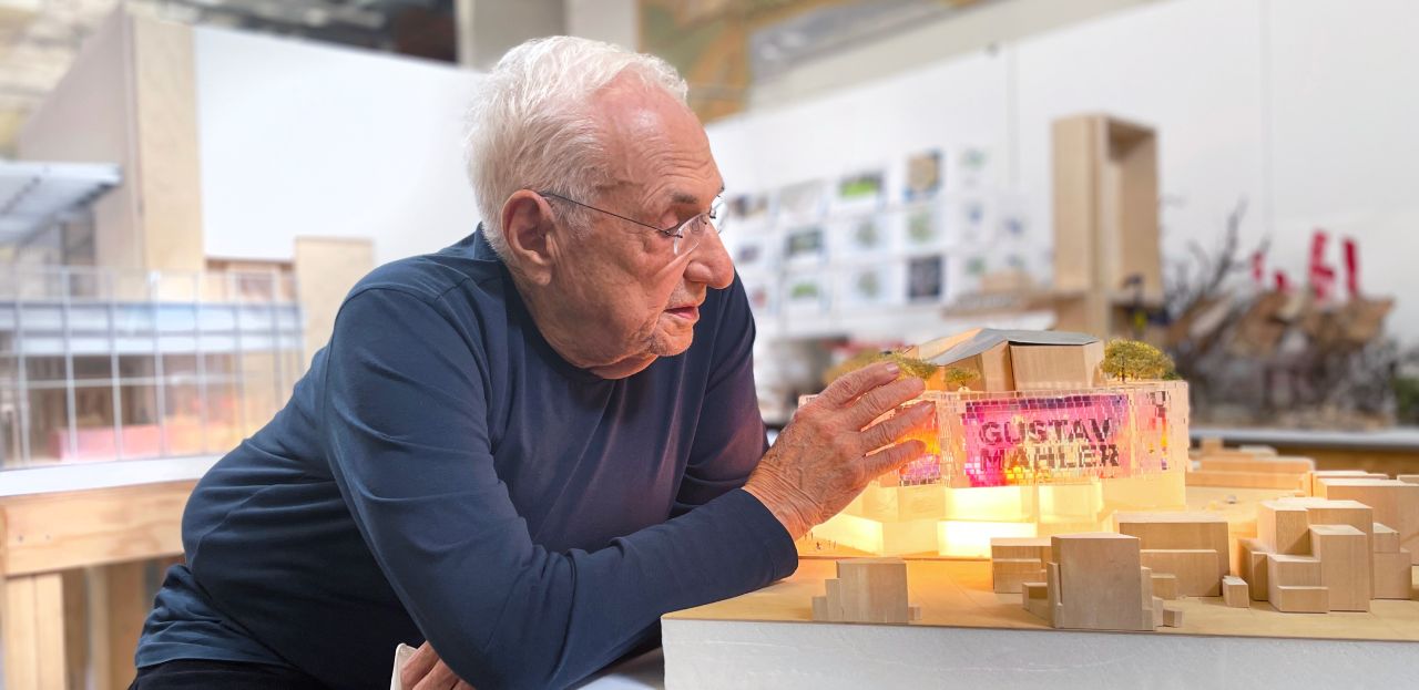 Frank Gehry with the Wimbledon Concert Hall model